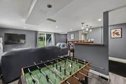 The Reel Retreat | Theatre & Firepit • Game Room
